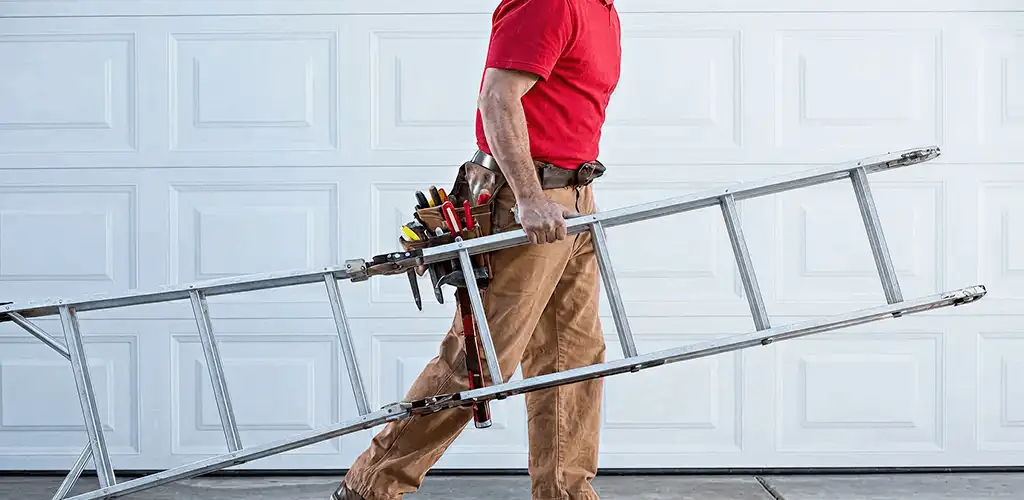 Garage door repair technician arriving with tools and ladder in Rochester, NY
